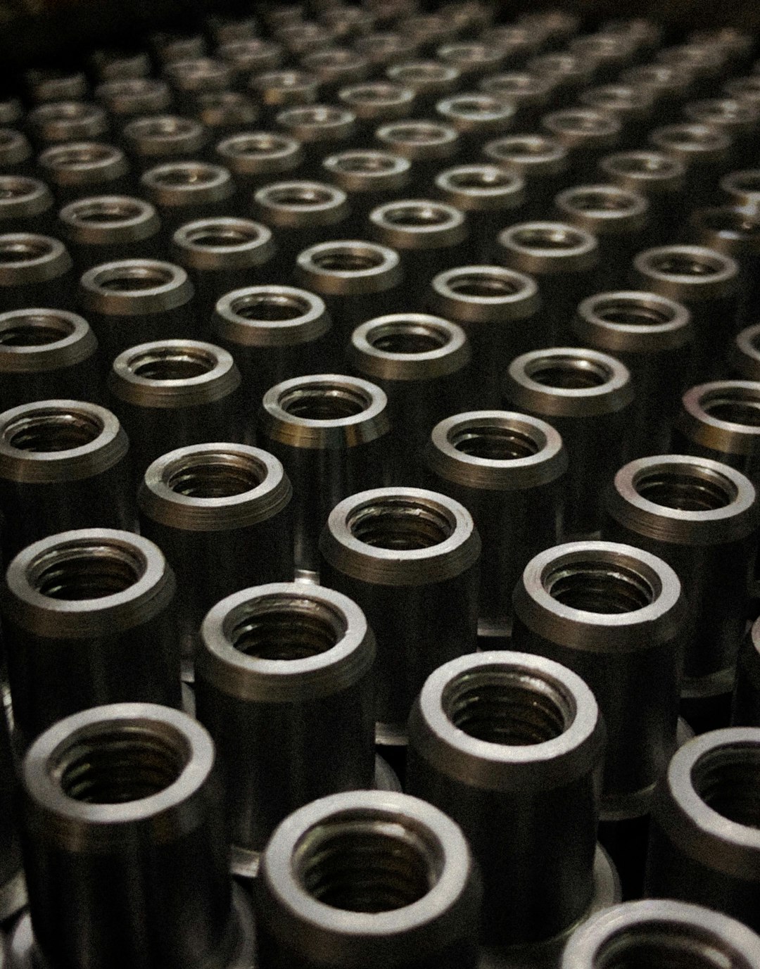 a-large-group-of-metal-flanges-sitting-on-top-of-a-table-c2s-2gmmqlw