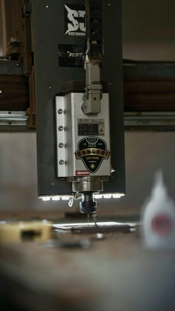 Close-up of a Bangsri guitars CNC machine showcasing precision in modern luthier workshops.